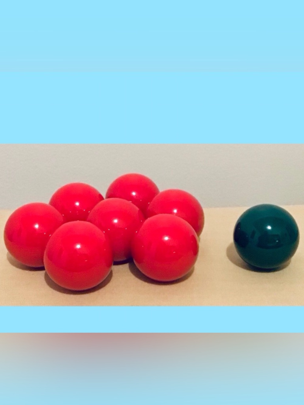 Eight (8) small heavy balls